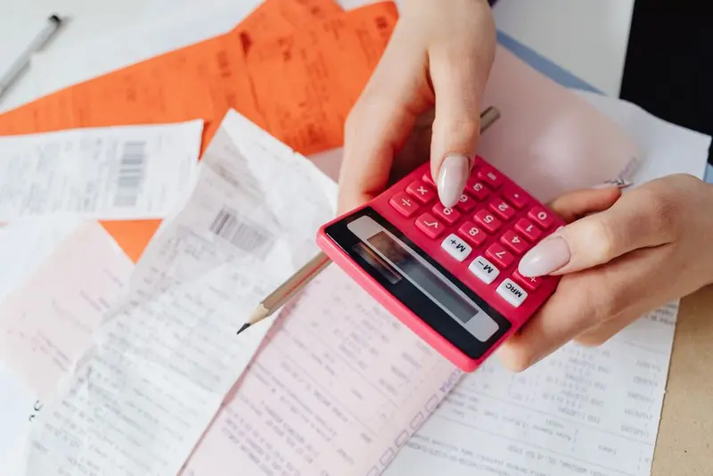 Invoices and receipts being processed at an office desk