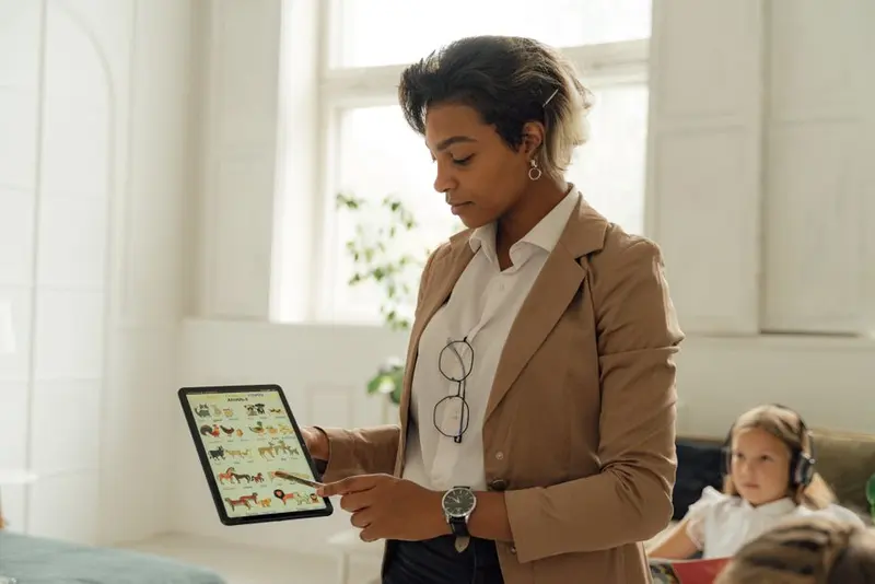 A teacher using a tablet at school